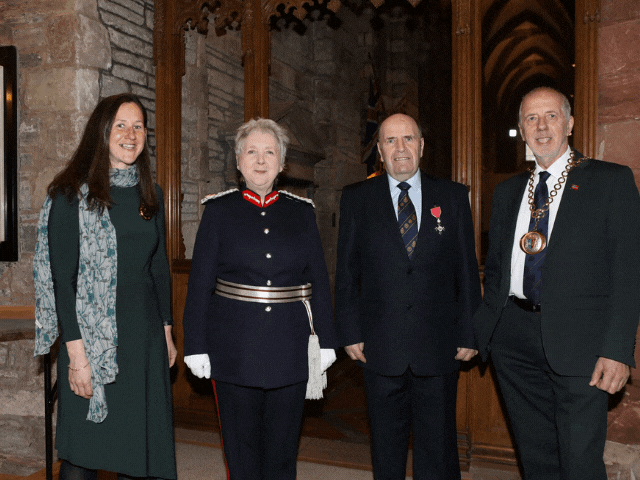 From the Mart to an MBE – John receives medal after two-year wait